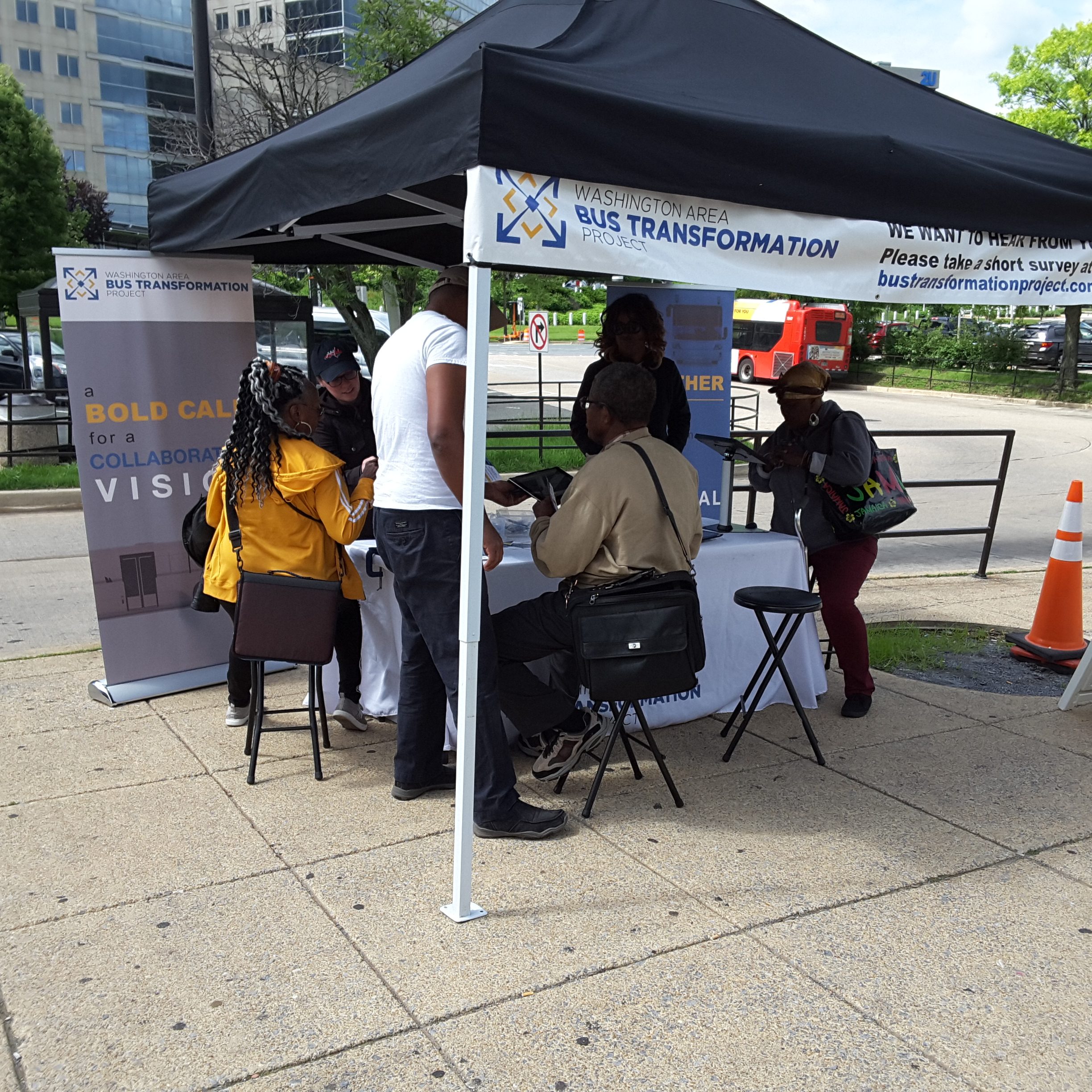 Event booth with people at the New Carrollton Metro Station