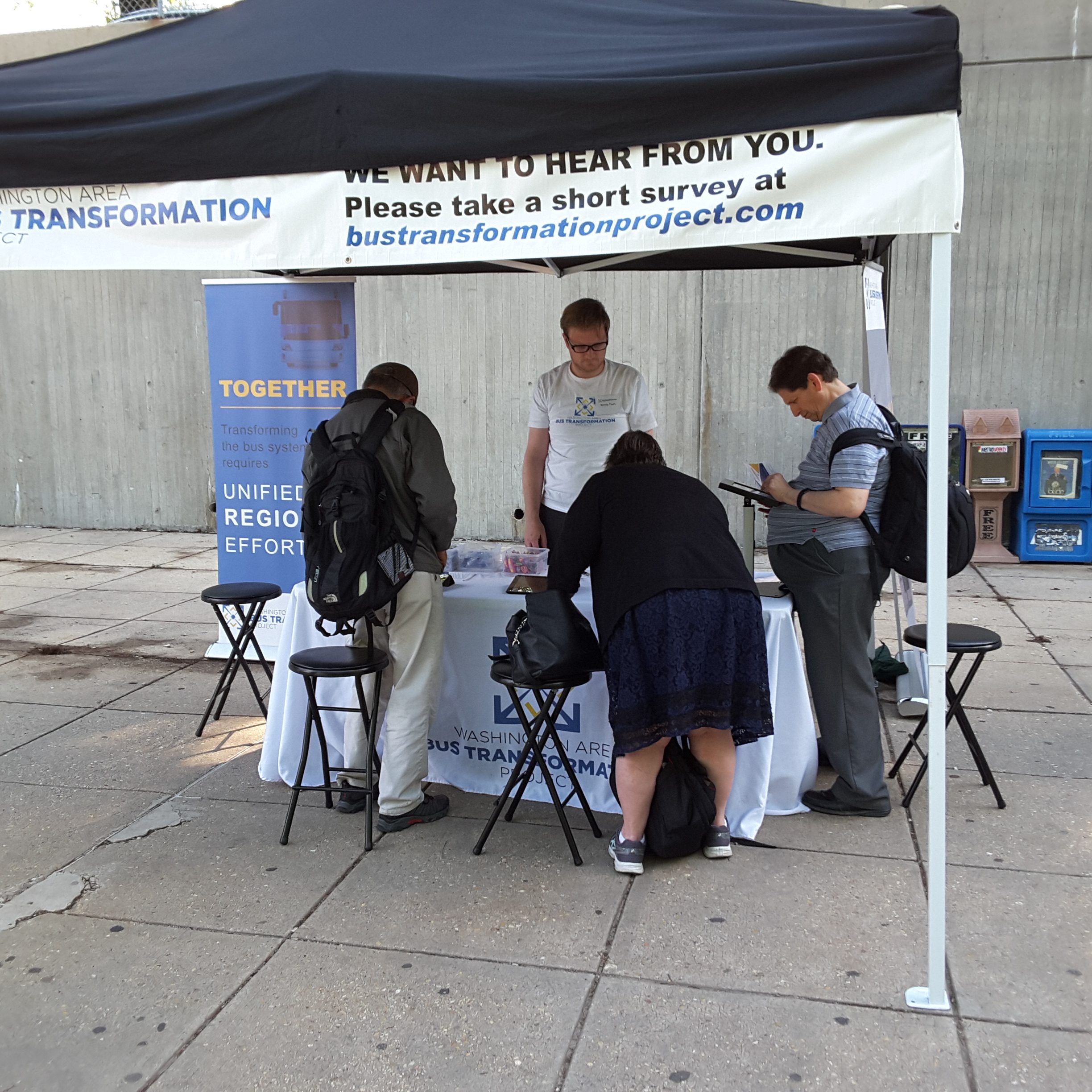 Event booth with people at the Shady Grove Metro Station