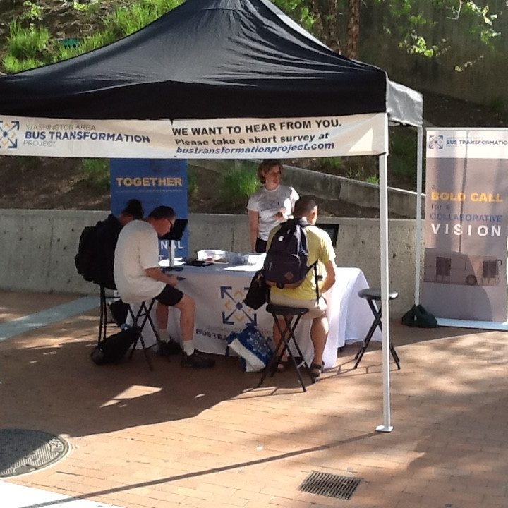 Event booth with people at the Silver Spring Paul S. Sarbanes Transit Center