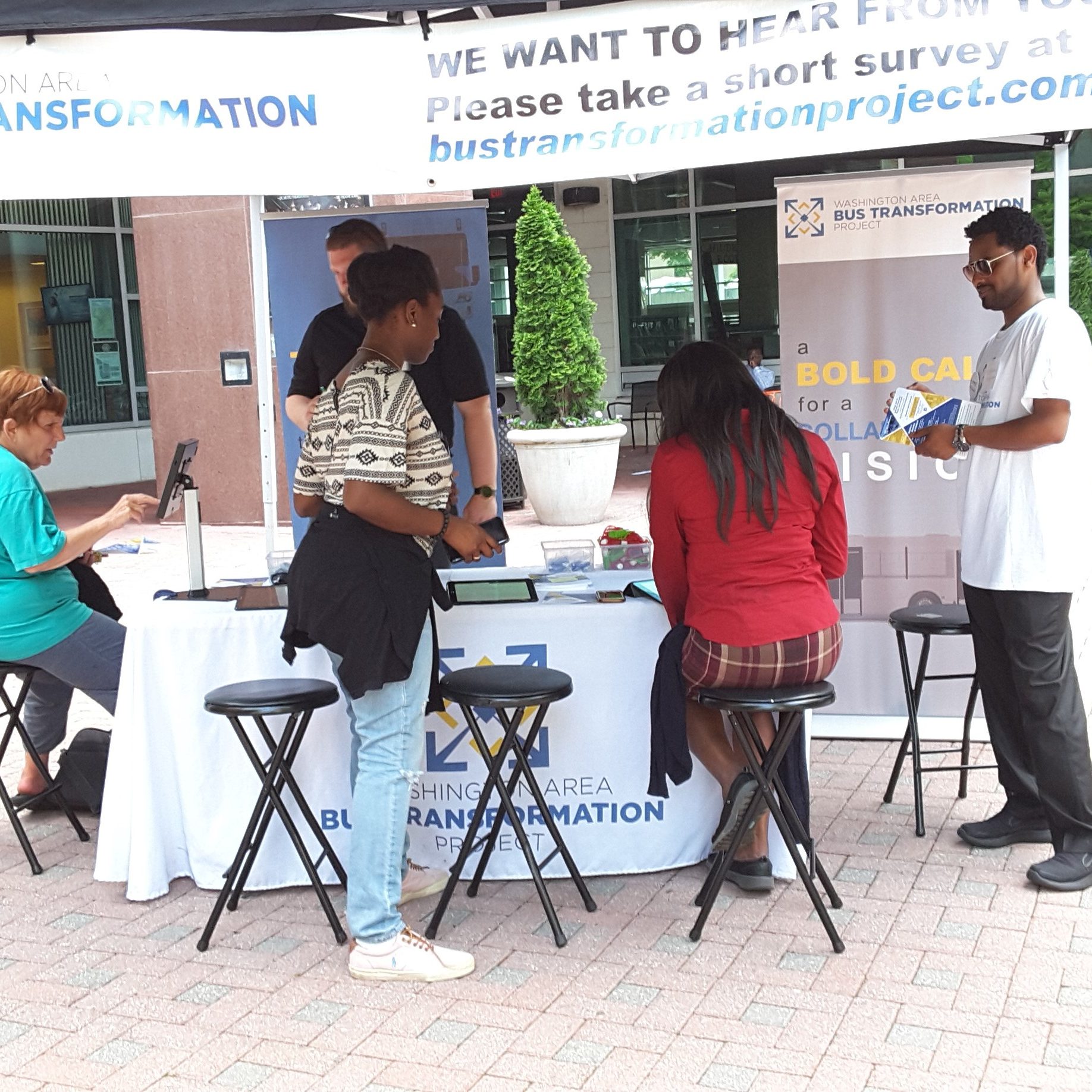 Event booth with people at the Village at Shirlington